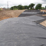 EPDM liner conforming the round, curving earth.