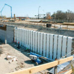 Vertical strip drain in retaining wall