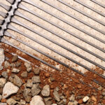 Adding aggregate to geogrid for better confinement and stabilization