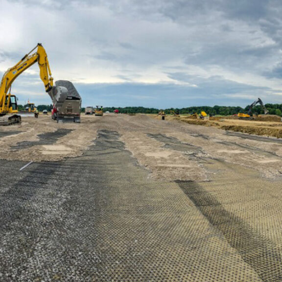 Civil engineers using Tensar Triax geogrid for road construction