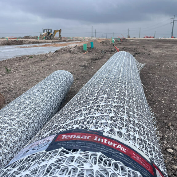 Newly delivered geogrid ready to be rolled onto the ground.