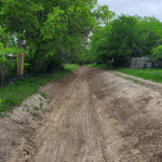 The earthen drainage channel at Blossom Park before upgrading to a concrete drainage channel.