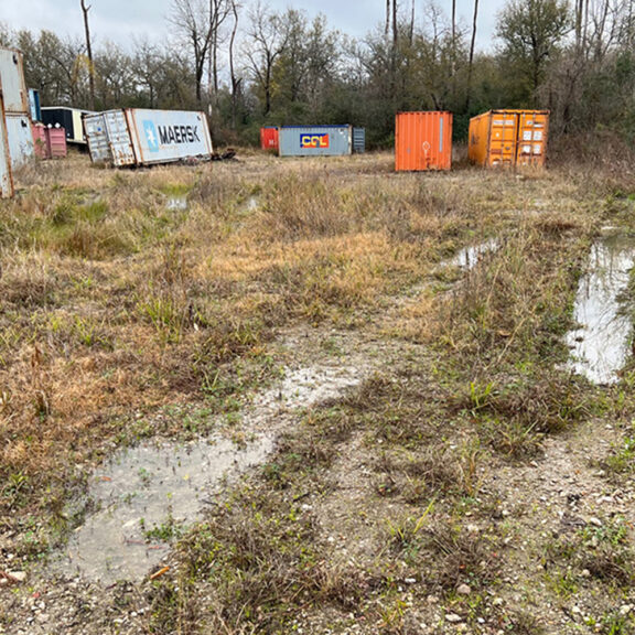 Poor drainage lanes at the Oates Road Container Yard before installing NX 850.