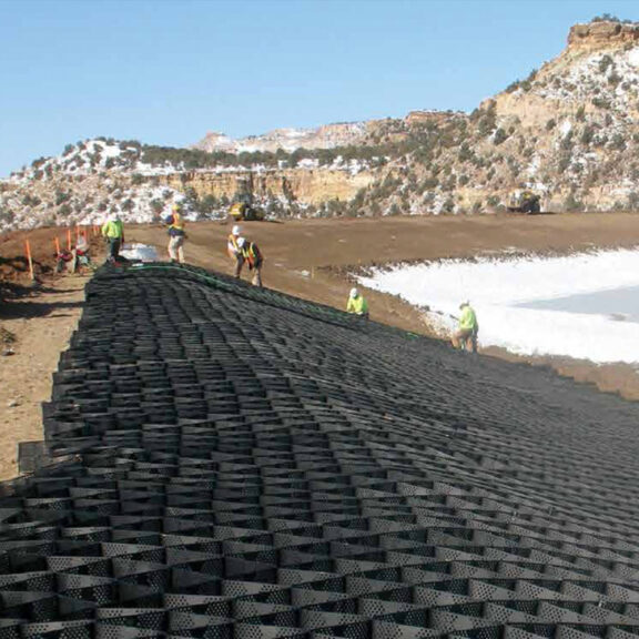 Installing Presto Geoweb on a slope for superior soil stabilization.